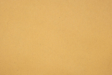 Texture of brown craft or kraft paper background, cardboard sheet, recycle carton paper, copy space for text.