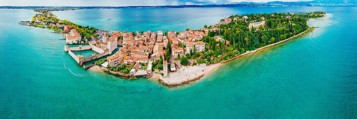 Port of Sirmione on Lake Garda, Brescia, Lombardy, Italy. Big landscape panorama from the island