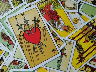 Picture of the Three of Swords tarot card from the original Ride Waite tarot deck with mixed tarot...