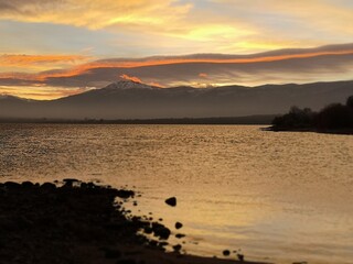 sunset on the lake in the mountains