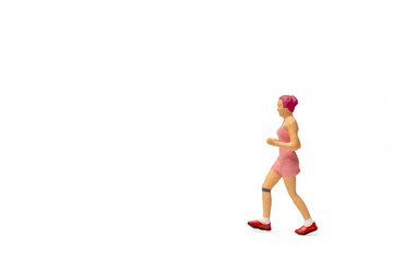 Miniature people, Woman in fitness wear running on white background