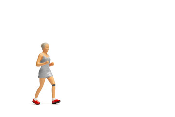 Miniature people, Woman in fitness wear running on white background