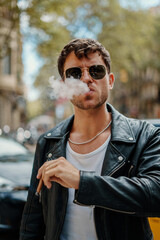 Portrait of sexy man near subway metro station entrance