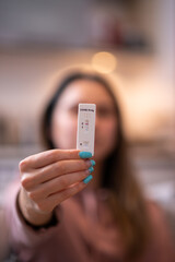 Girl holding a corona virus SARS-Cov-2 rapid antigen test