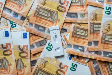 Corona virus SARS-Cov-2 antigen test on euro banknotes