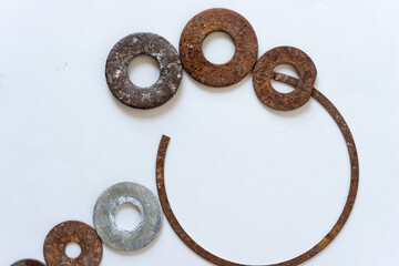 metal objects loosely arranged on a paper background