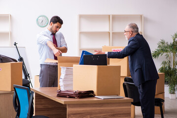 Two male employees in relocation concept