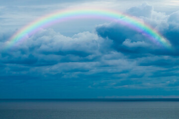Beautiful sea with a rainbow in the sky