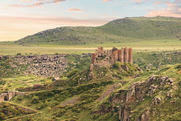 Fototapeta na wymiar Panoramic view of famous Vahramashen Church located near Amberd fortress in Armenia. It sits on the cliff with Arkashian River deep in the canyon