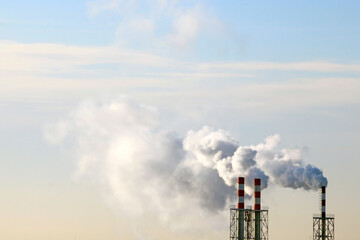 Thick smoke comes from the production pipe.