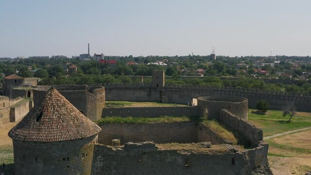 Belgorod-Dnestrovskaya fortress from a bird's eye view. The largest fortress in Ukraine is located on the Dniester River. Green blooming water and white-stone walls of the fortress.