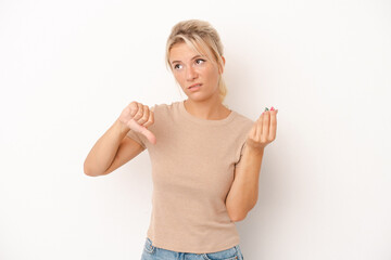 Young Russian woman isolated on white background showing that she has no money.