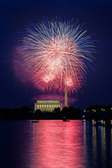 The Show Begins - Fourth of July Fireworks Over the Lincoln Memorial and Washington Monument Reflected in the Potomac River.  