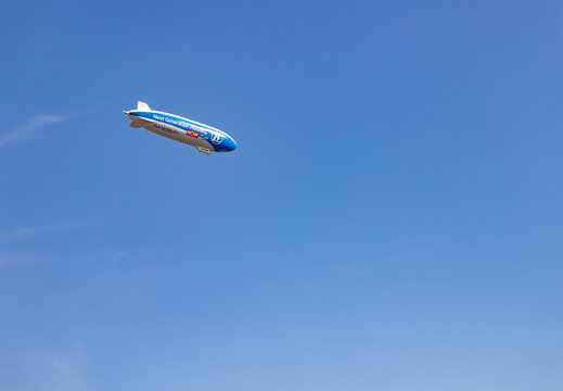 Katowice, Poland - September 11, 2021: A picture of an advertising zeppelin from ZF flying in Katowice.
