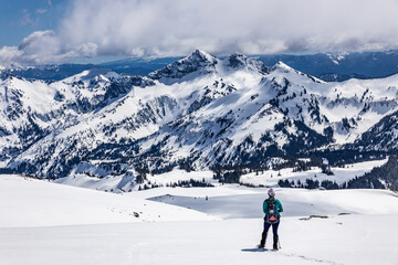 Fototapeta na wymiar A hiker observing mountains in Mount Rainier National Park