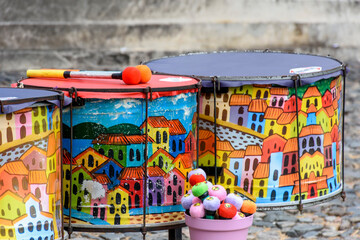 Ethnic and colorful decorated set of drums hand made painted on the streets of Pelourinho, Salvador, Bahia