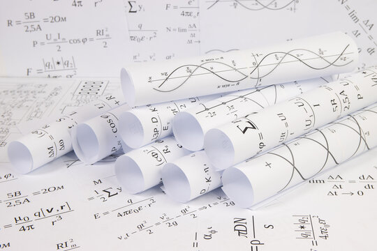 printed on paper mathematical electrical formulas, graphs and engineering drawings