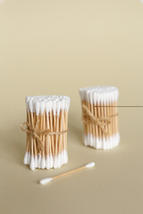 Fototapeta na wymiar Cotton swabs with wooden sticks isolated on background with copy space.