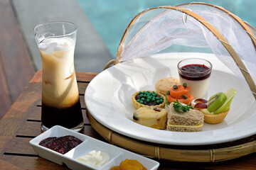 Traditional afternoon tea in the swimming pool