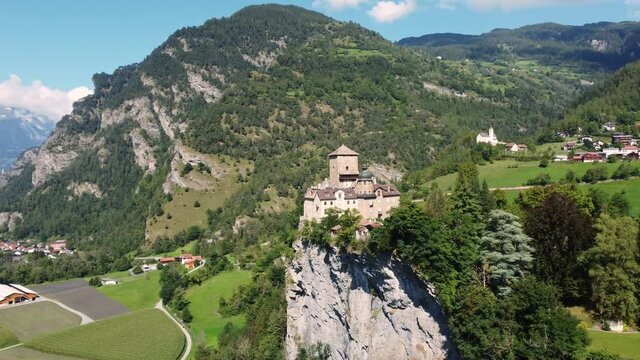Aerial drone footage of the Ortenstein castle on a hilltop near Thusis in Canton Graubunden in the alps in Switzerland