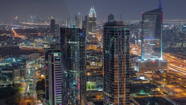 Aerial view of media city and internet city night timelapse from Dubai marina.