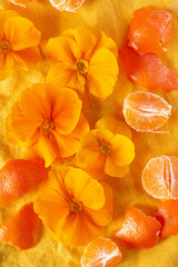 orange primroses and fruits on the orange linen fabric