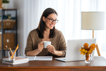 young woman working at home