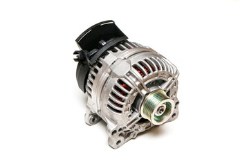 The new shiny alternator for the motor vehicle as a spare part to replace the broken one.  - obrazy, fototapety, plakaty