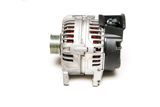 The new shiny alternator for the motor vehicle as a spare part to replace the broken one. 