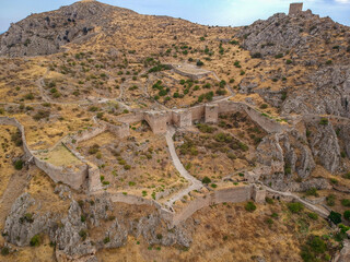 Aerial view of Acrocorinth "Upper Corinth" the acropolis of ancient Corinth, Greece. It is a monolithic rock overseeing the ancient city of Corinth