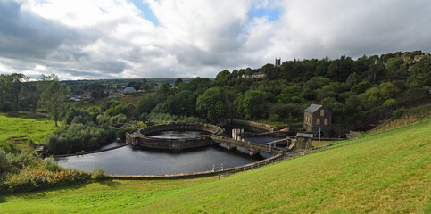 Fototapeta premium Bottoms Reservoir and river Etherow with village of Tintwistle in background Derbyshire.