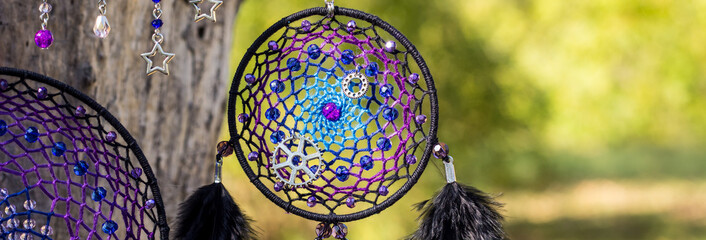 banner of Handmade dream catcher with feathers threads and beads rope hanging