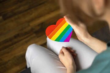 Gay rainbow flag in heart shape, LGBT symbol. Concept of tolerance, gay pride, lesbian rights