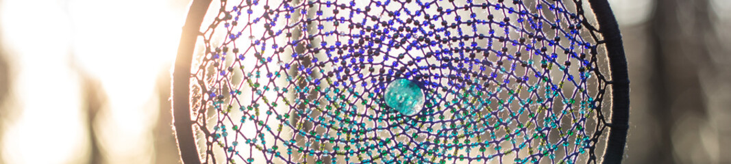 banner of Handmade dream catcher with feathers threads and beads rope hanging