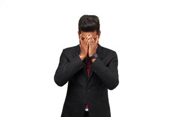 Headache of an Indian manager in a suit on an isolated white background