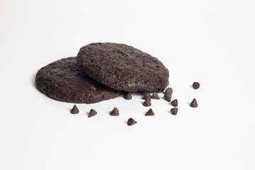 Fototapeta premium Chocolate chip cookies isolated on white background. Sweet dessert biscuits. Homemade pastry. Top close shot.