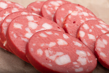 sliced uncooked smoked sausage close up, sausage for sandwiches.