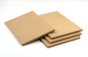 One MDF board leaning on Three MDF boards.