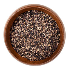 black rice grain in wood bowl isolated on white background