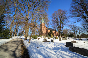 landscape with snow covered trees, church of Østre Aker, Oslo, Norway