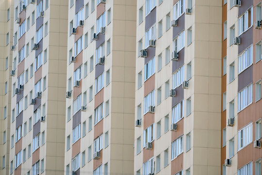 Windows on the facades of high-rise apartment buildings, close-up