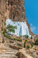 The famous Hozoviotissa Monastery standing on a rock over the Aegean sea in Amorgos island,...