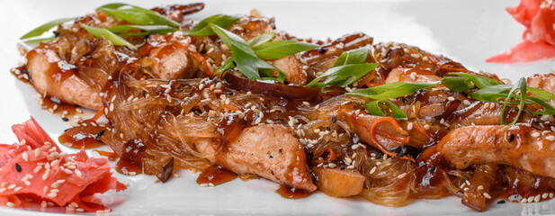 Delicious fresh udon with chicken and rice noodles with spices and greens