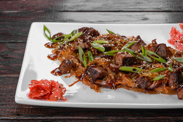 Delicious fresh udon with beef and rice noodles with spices and greens