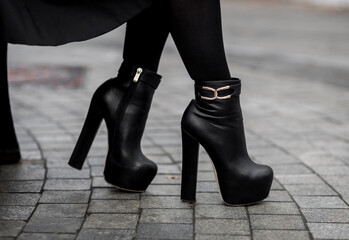 Closeup of stylish black ankle boots