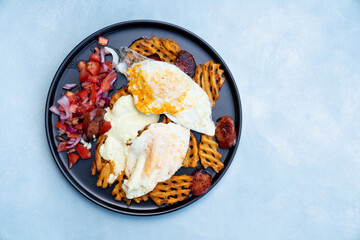 Eggs, sausage and fries breakfast
