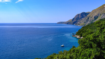 Obraz premium Cilento coast, Scario. Campania, Italy. View of the azure sea, coast and boat.