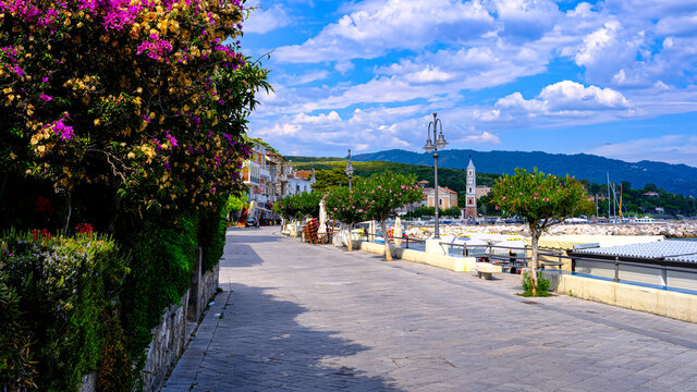 Cilento coast, Scario. Campania, Italy. View of the course with trees, church.