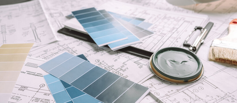 Architect works remotely from home in quarantine, lockdown covid 19 coronavirus. Remote work, stay home, new normality, social distance. Architect design working drawing sketch plans blueprints