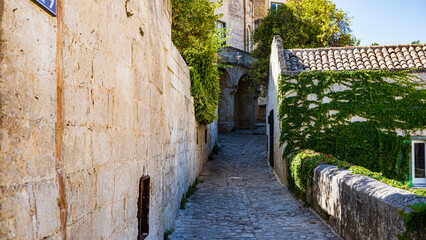 View of the historic center of Matera, Sassi. Basilicata. Italy. alley with house, window and ivy